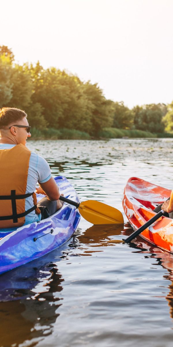 Couple together kayaking on the river